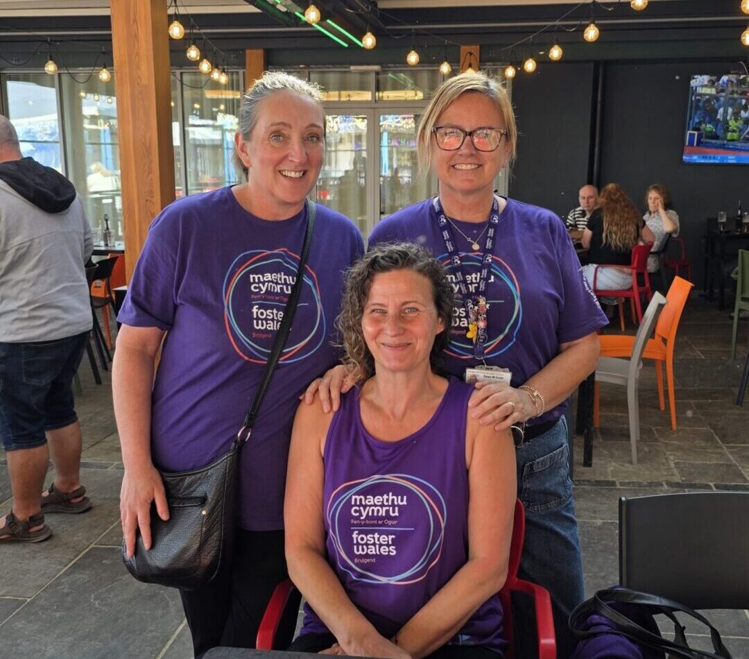 Three supervising social workers smiling in Bridgend support